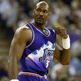 Karl Malone officially announced his retirement in what year?